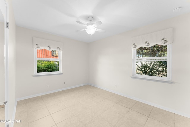 spare room with ceiling fan