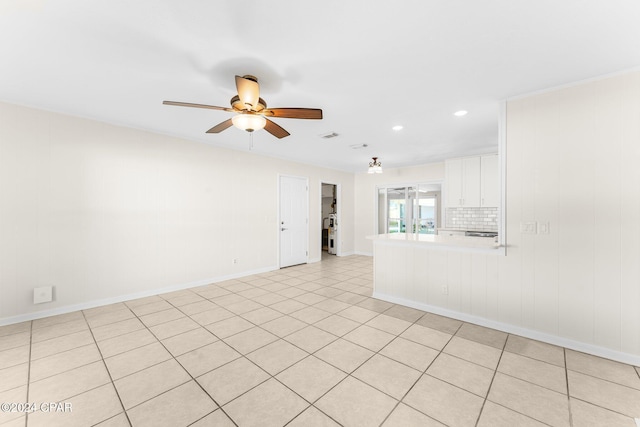 unfurnished room with ceiling fan