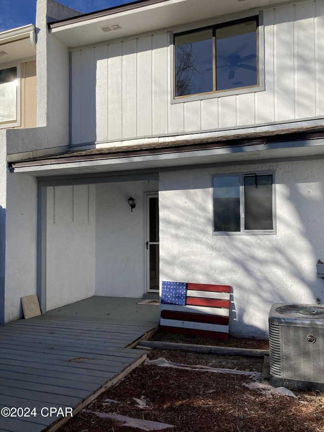 exterior space with central AC and a wooden deck