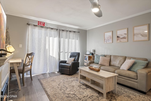 living room with wood-type flooring, ceiling fan, and ornamental molding