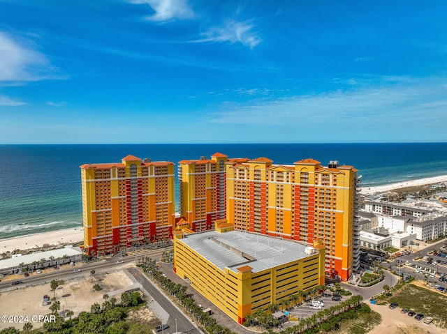 birds eye view of property with a water view and a view of the beach