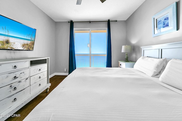 bedroom featuring access to exterior, ceiling fan, and dark wood-type flooring