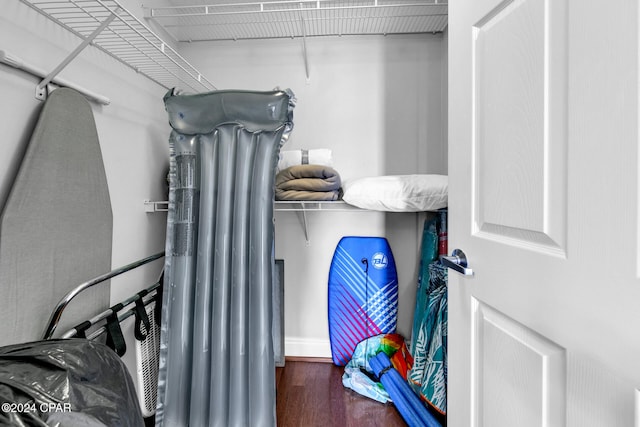 spacious closet featuring dark hardwood / wood-style floors