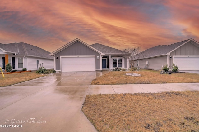 ranch-style house featuring a yard and a garage