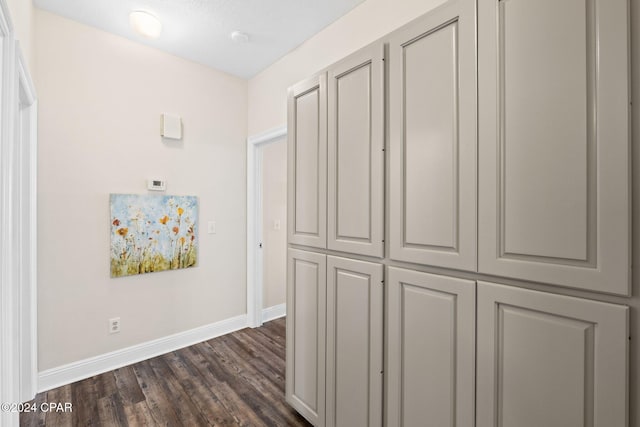 corridor with dark wood-type flooring