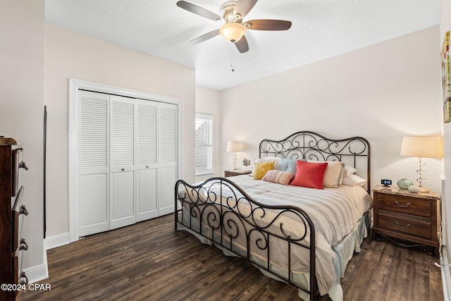 bedroom with ceiling fan, dark hardwood / wood-style flooring, a closet, and a textured ceiling