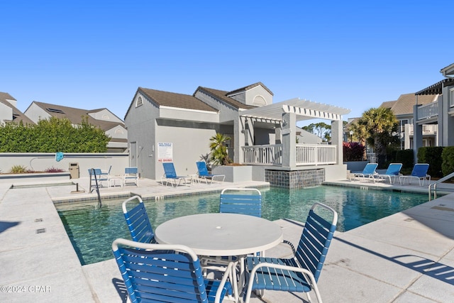 view of pool featuring a patio area and a pergola