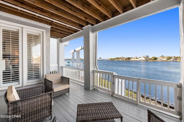 wooden terrace with a water view