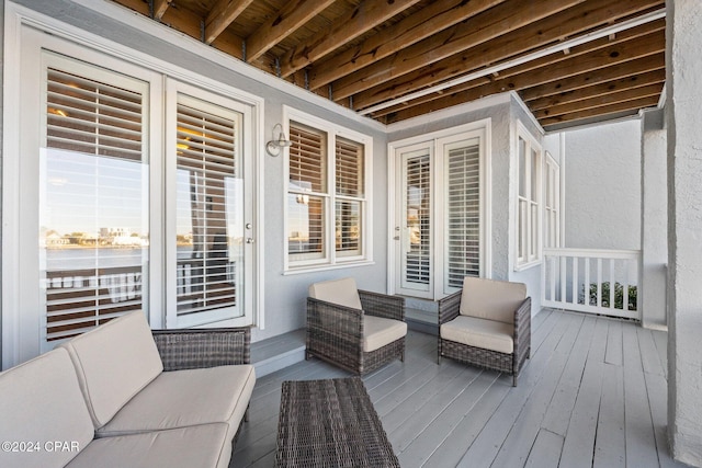 wooden terrace featuring an outdoor living space