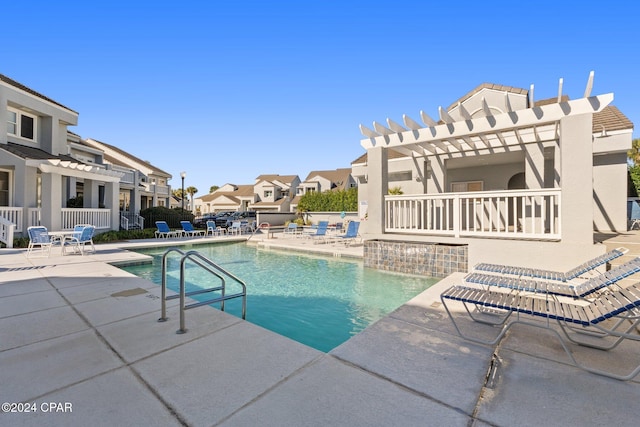 view of swimming pool with a pergola and a patio area