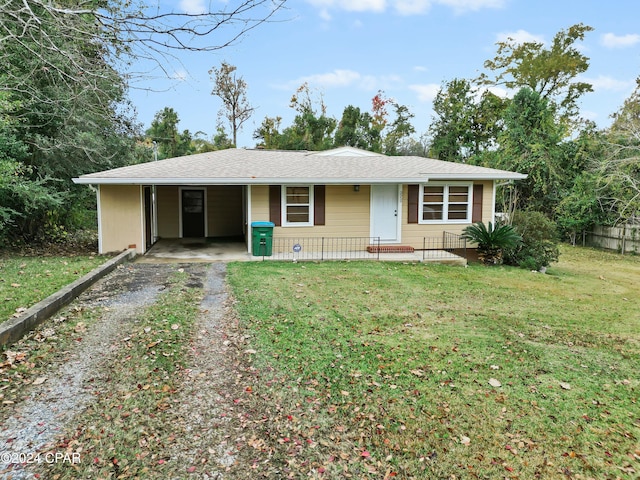 ranch-style house with a front lawn and a carport