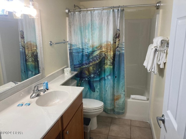 full bathroom with tile patterned flooring, shower / bath combo, toilet, and vanity