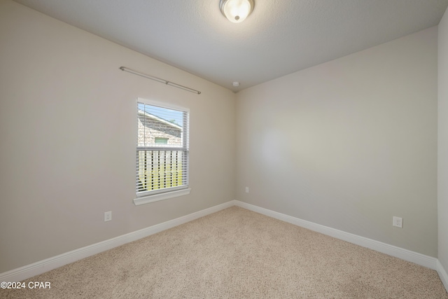 empty room featuring carpet flooring