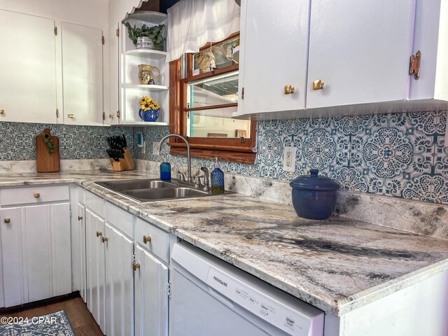 kitchen featuring white cabinetry, white dishwasher, sink, and backsplash