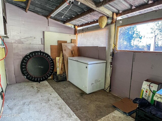 basement featuring fridge