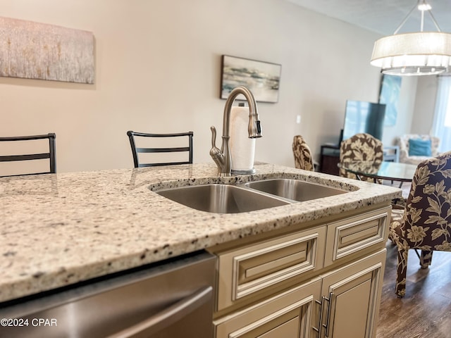 101 S 39th St Unit C, Mexico Beach, FL 32456 - kitchen with a sink, stainless steel dishwasher, dark wood-style flooring, and light stone counters