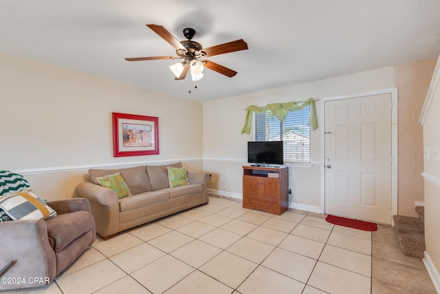 living room with ceiling fan and light tile patterned floors