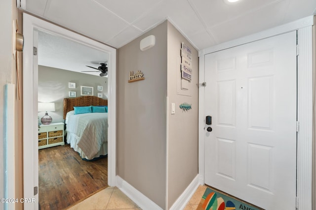 foyer featuring ceiling fan and light hardwood / wood-style floors