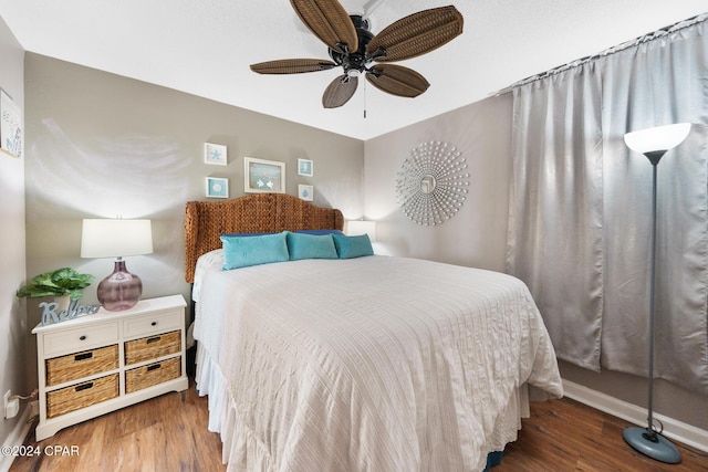 bedroom with ceiling fan and hardwood / wood-style floors