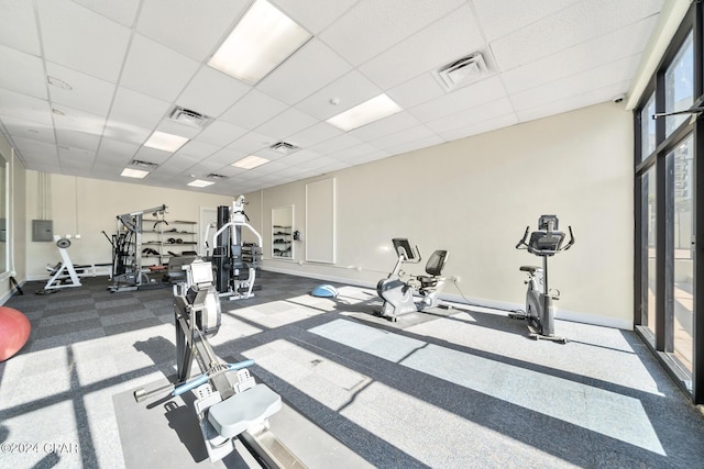 exercise room featuring a drop ceiling