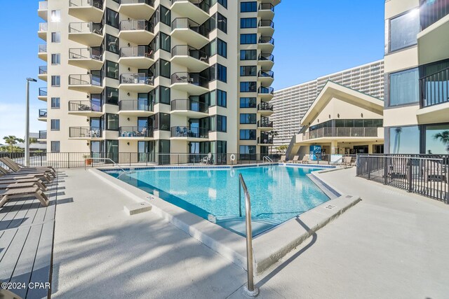 view of swimming pool with a patio area