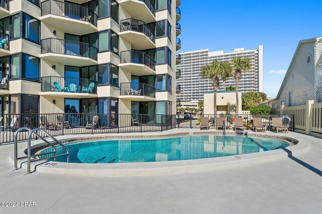 view of swimming pool featuring a patio