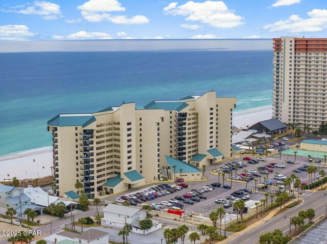 bird's eye view with a water view and a view of the beach