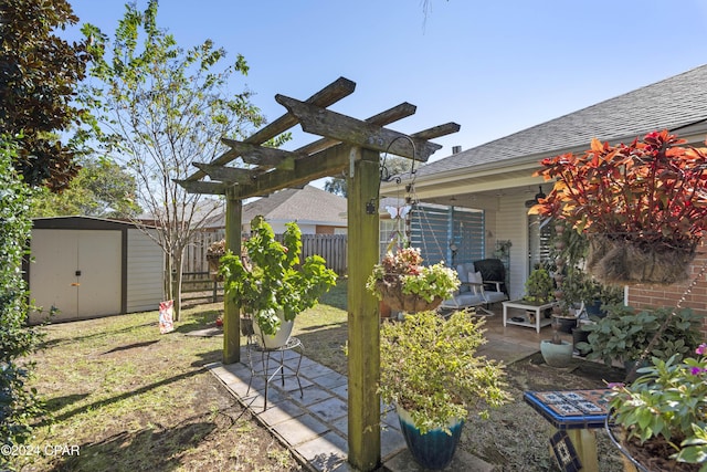 view of yard featuring a storage unit, a patio, and a pergola