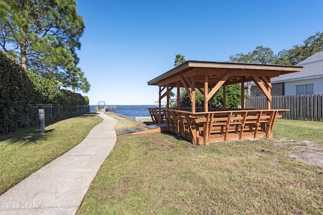 exterior space featuring a yard, a water view, and a gazebo