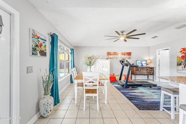 tiled dining area with ceiling fan