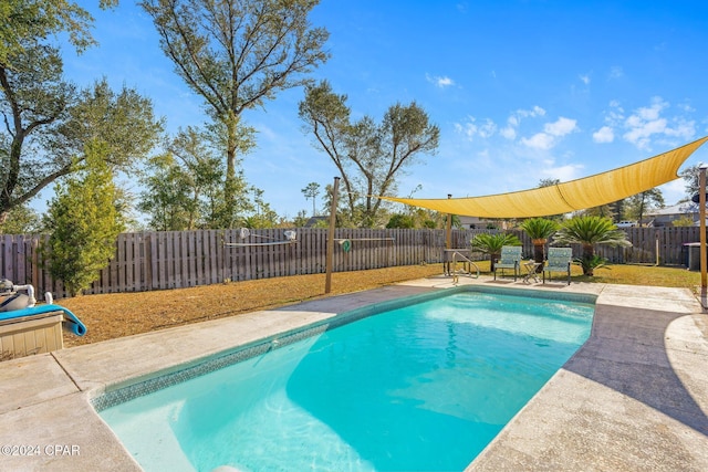 view of pool with central AC and a patio