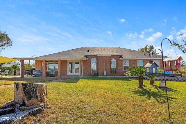 ranch-style home with a front lawn