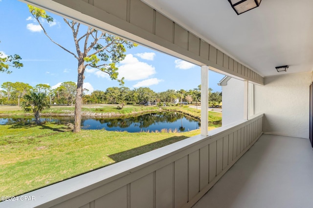 balcony featuring a water view