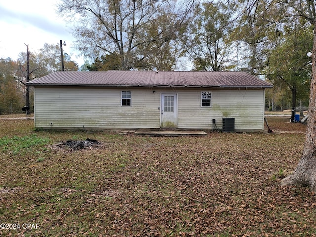 rear view of property featuring a patio area and central AC unit