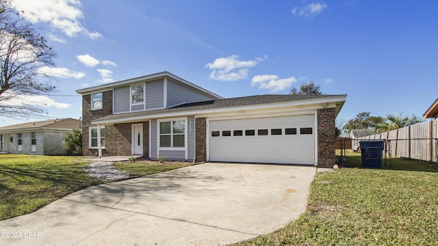 view of front property with a garage and a front yard