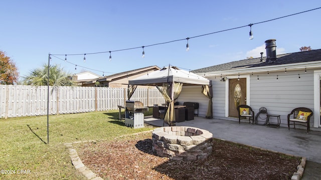 view of yard with a patio and a fire pit