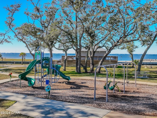 view of jungle gym with a water view