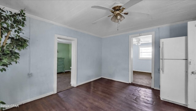 unfurnished room with ornamental molding and dark wood-type flooring