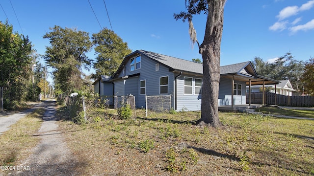 view of side of home featuring a porch