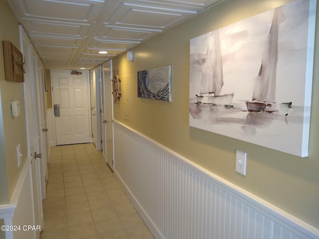 hallway with light tile patterned floors