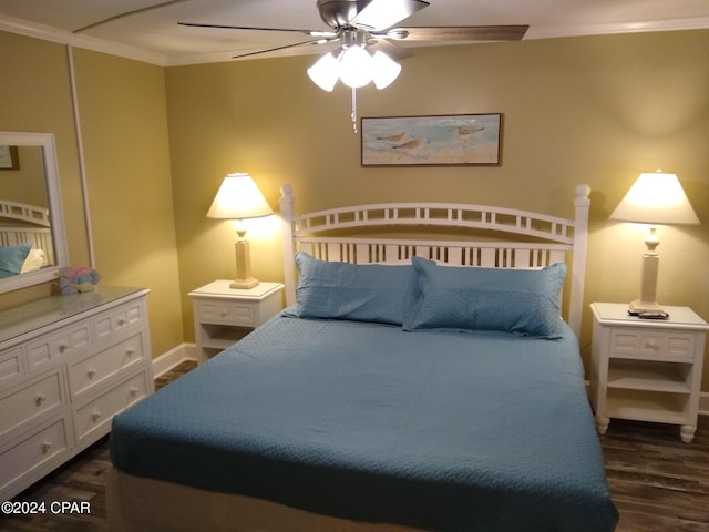 bedroom featuring dark hardwood / wood-style floors, ceiling fan, and ornamental molding