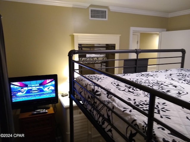 bedroom featuring crown molding