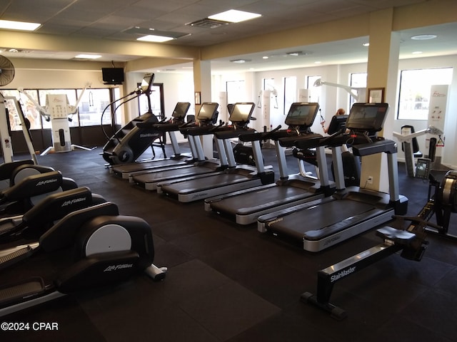 workout area featuring a drop ceiling