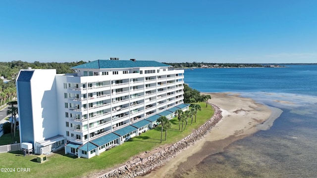 bird's eye view featuring a view of the beach and a water view