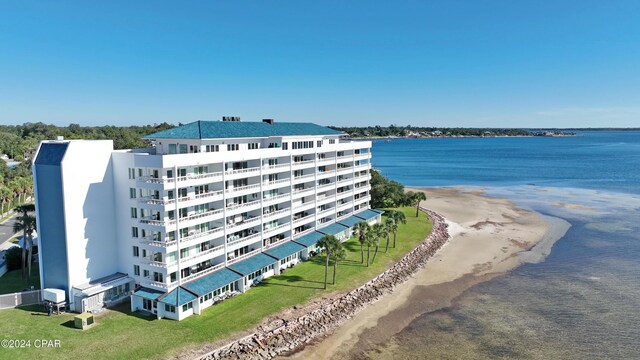 bird's eye view featuring a view of the beach and a water view