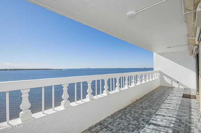 balcony featuring a water view