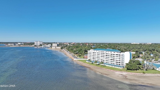 drone / aerial view with a beach view and a water view