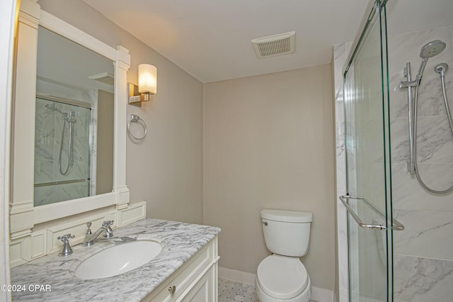 bathroom featuring walk in shower, vanity, and toilet