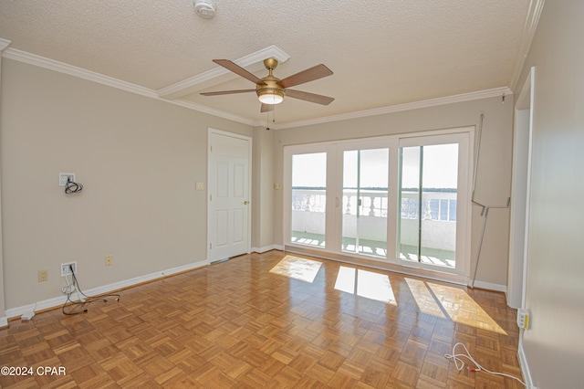 empty room featuring a textured ceiling, ornamental molding, and ceiling fan