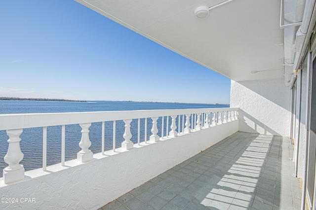 balcony featuring a water view